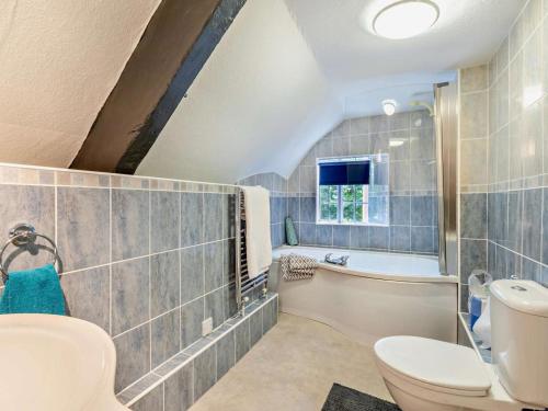 a bathroom with a sink toilet and a tub at 6 Bed in Taunton oc-95371 in Bicknoller