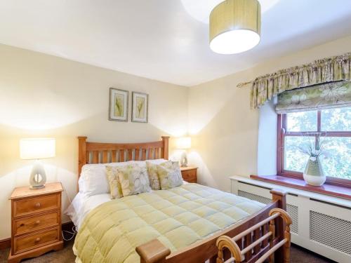a bedroom with a bed and a window at 2 Bed in Skipton oc-79093 in Skipton