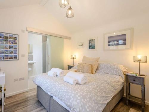 a bedroom with a bed with towels on it at 1 Bed in Wareham oc-87150 in Stoborough