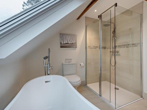 a bathroom with a toilet and a glass shower at 3 Bed in Salisbury oc-66130 in Redlynch