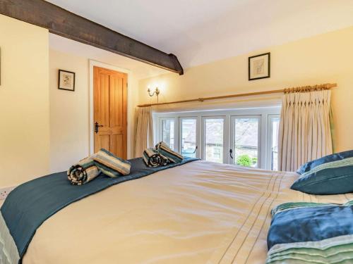 a large bed in a room with a window at 4 Bed in Consett oc-cn108 in Hunstanworth