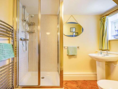 a bathroom with a shower and a sink at 4 Bed in Consett oc-cn108 in Hunstanworth