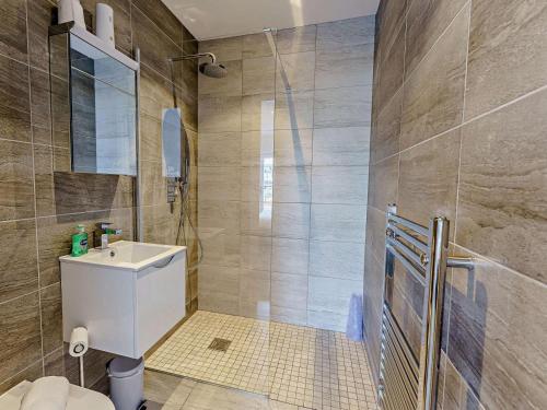 a bathroom with a toilet and a sink and a shower at 2 Bed in Sandown oc-83617 in Sandown