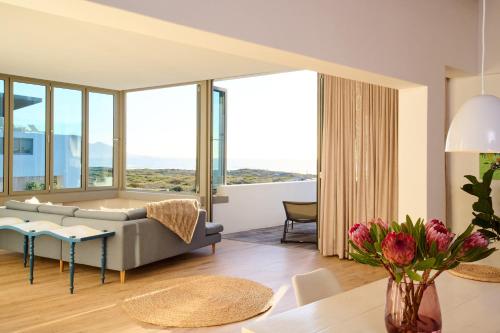 a living room with a couch and a table at ocean10 Guesthouse in Cape Town