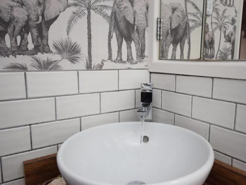 a bathroom with a white toilet and a sink at 2 Bed in Otley oc-75268 in Lindley