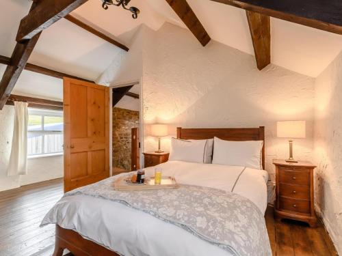 a bedroom with a large bed with a tray on it at 2 Bed in Bishop Auckland oc-93111 in Westgate