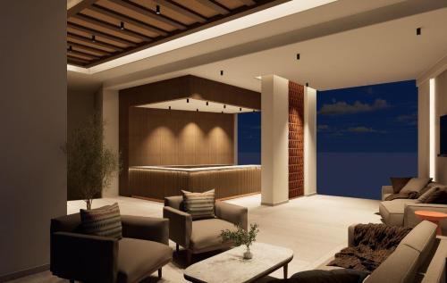 a living room with couches and a bar at Ekavi Hotel in Sfakaki