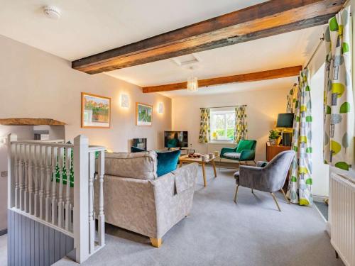 a living room with a couch and a crib at 3 Bed in Nr Masham oc-g0149 in Healey