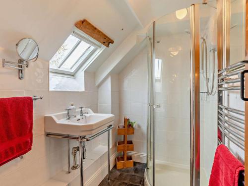 a bathroom with a sink and a shower at 3 Bed in Backworth oc-cn011 in Backworth