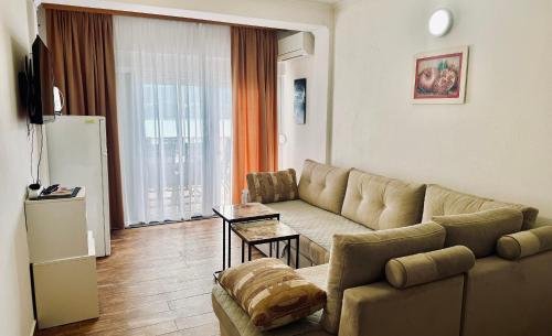 a living room with a couch and a table at Villa Tex in Neum