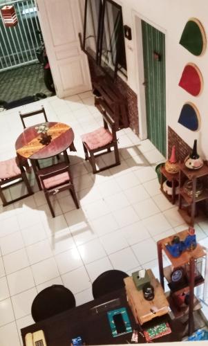 an overhead view of a living room with tables and chairs at Edotel Tebe Syariah in Rampal