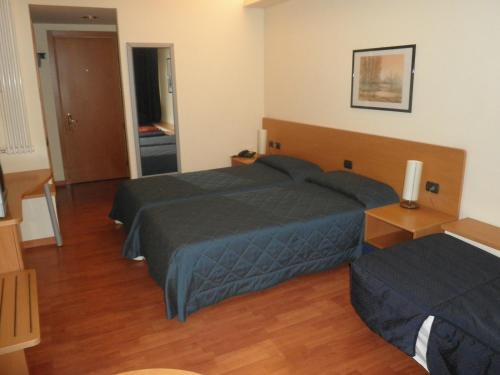 Postel nebo postele na pokoji v ubytování Hotel Selide