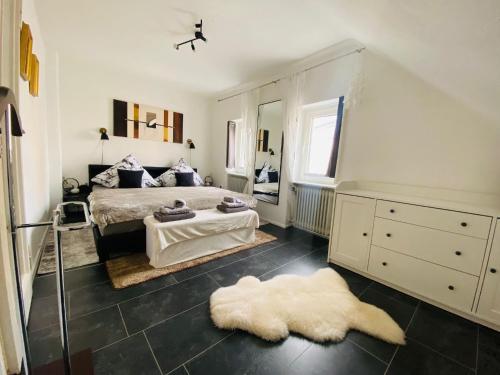 a bedroom with two beds and a mirror at Schatte's kleines Appartement in Seelze in Seelze