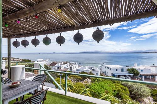 a view of the ocean from the balcony of a house at 43 Artemis, Langebaan, 8-sleeper in Langebaan