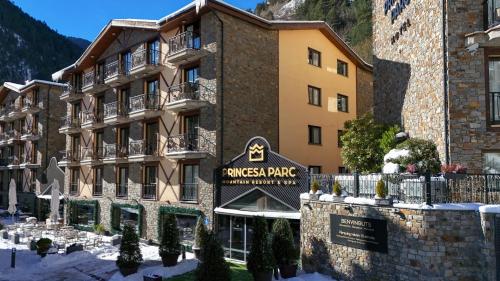 a building with a sign for a hotel at Hotel Princesa Parc in Arinsal