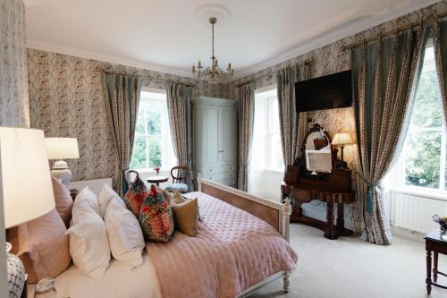 a bedroom with a bed and a piano at College Hill House in Slane