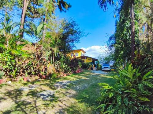 a house with a car parked in the driveway at Las Catalinas Ecológicas (El Maizal) in Antón