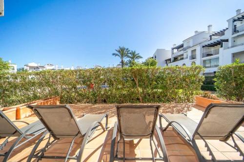 a group of chairs sitting on a patio at Nice Groundfloor Apartment - BO202LT in Torre-Pacheco