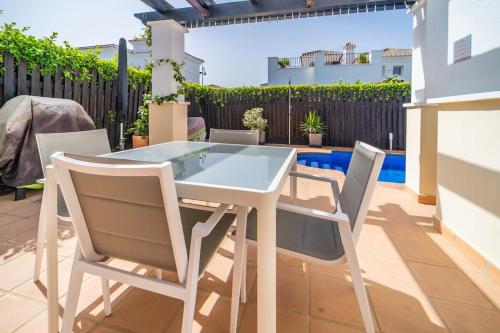 a white table and chairs on a patio at Villa with Private Pool - LO4LT in Torre-Pacheco