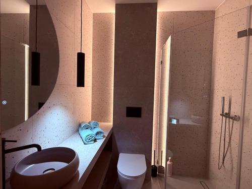 a bathroom with a toilet and a sink and a shower at Apartament 59 Bystra Park in Bystra