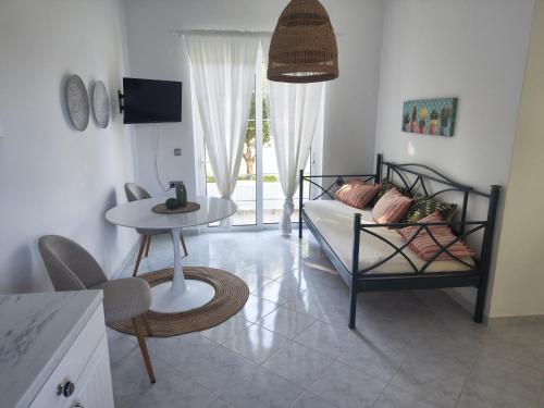 a living room with a couch and a table at Villa Rizia in Kolymbia