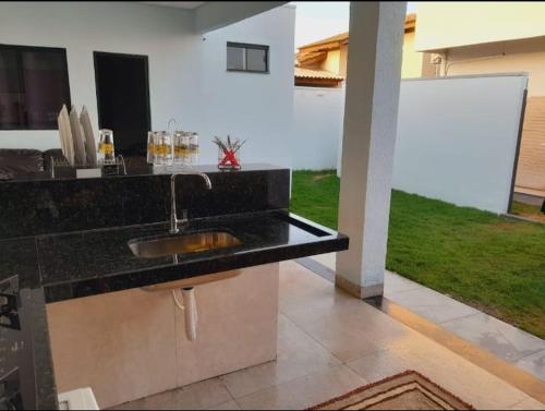 a kitchen counter with a sink and a yard at 3 A A a in Sinop