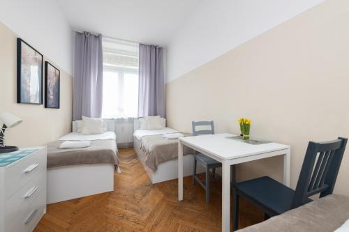 a living room with a couch and a table at Rooms Nearto Main Square in Krakow