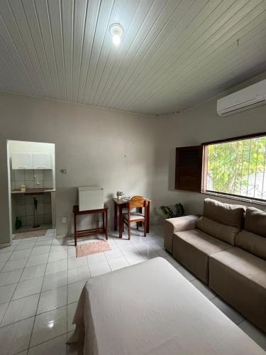 a living room with a couch and a table at Estação 48 in Castanhal