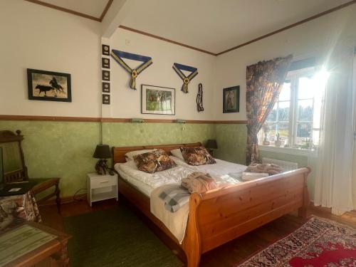 a bedroom with a bed and a window at Spa For Hjo in Hjo