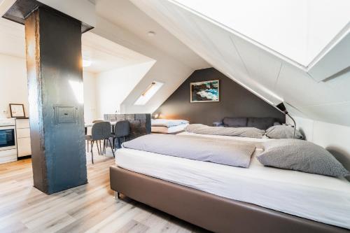 a bedroom with two beds in a attic at Guesthouse Andrea in Reykjavík