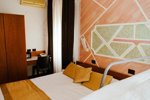 a hotel room with a bed and a desk at Hotel San Marco BB in Boario Terme