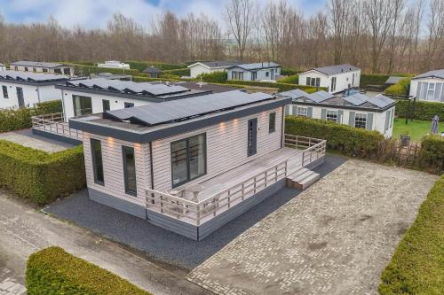 an overhead view of a house with a solar roof at Vakantiepark In Style in Dronrijp