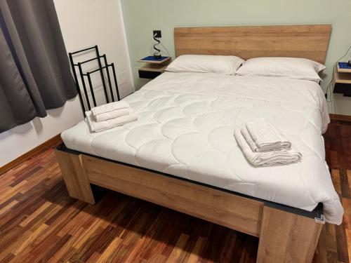 a bedroom with a bed with two towels on it at Dormire a Reggio zona Aeroporto in Reggio di Calabria