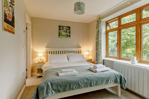 a bedroom with a bed with two towels on it at 2 Bed in Beer oc-s27769 in Beer