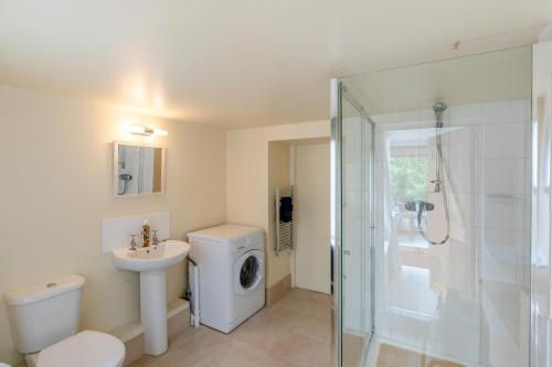 a bathroom with a washing machine and a sink at 2 Bed in Leintwardine oc-t29563 in Leintwardine