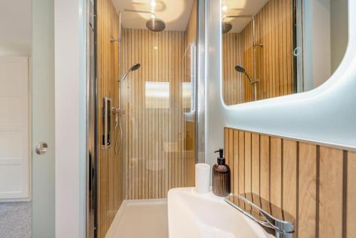 a bathroom with a sink and a shower at 3 Bed in Croyde oc-f33111 in Croyde