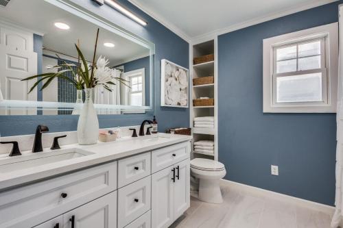 a bathroom with a white sink and a toilet at LWV Dallas Social - Lakewood Village in Little Elm