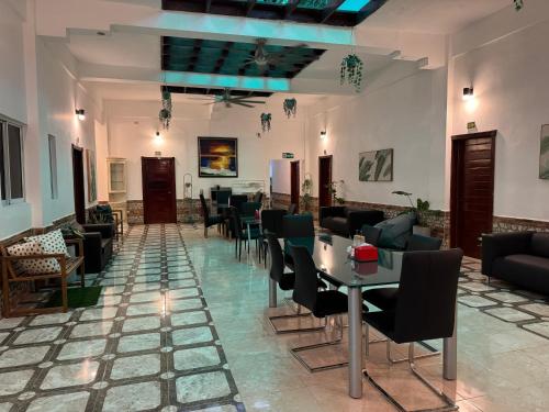 a restaurant with chairs and tables in a room at Colonial Hotel Boutique by VBermor in Santo Domingo
