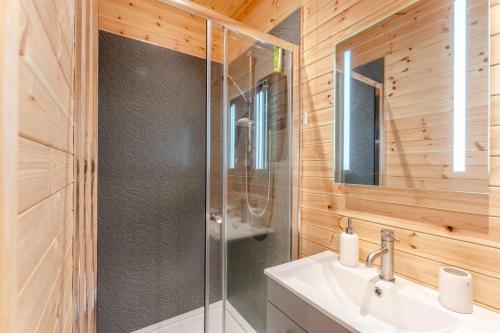a bathroom with a glass shower and a sink at 2 Bed in Strathmiglo oc-w32098 in Strathmiglo