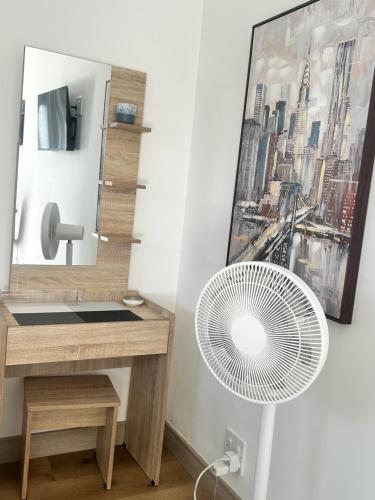 a bathroom with a sink and a fan at Dove Cottage in Oakdale