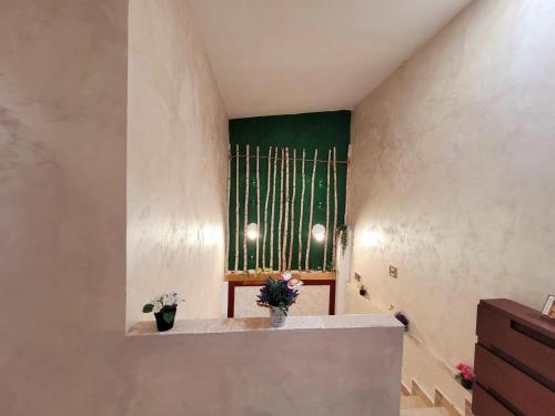 a room with a large window with a harp at MAG Motel in Bucharest