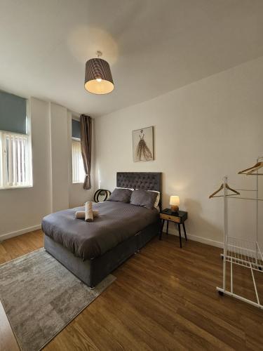 a bedroom with a large bed in a room at City Centre stay in Liverpool