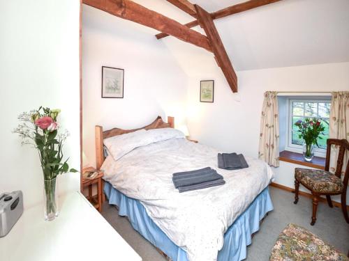 a bedroom with a bed and a window at 3 Bed in Stocksfield oc-32252 in Stocksfield