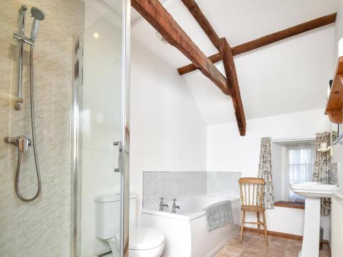 a bathroom with a shower and a toilet and a sink at 3 Bed in Stocksfield oc-32252 in Stocksfield