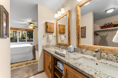 a bathroom with a sink and a mirror at Pines #2165 in Keystone