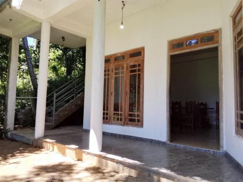 a view of the front porch of a house with glass doors at Tha Ivory villa in Nattarampota