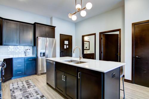 a kitchen with a sink and a refrigerator at Fairway in Altoona