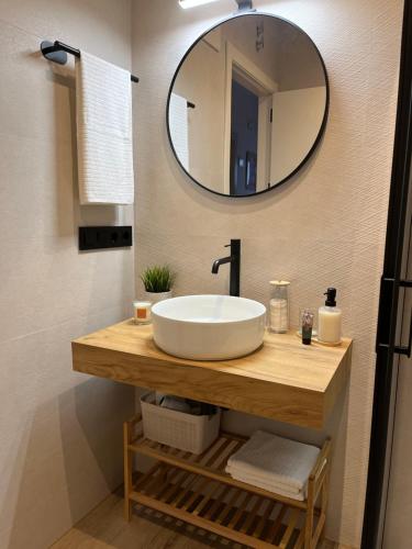 a bathroom with a sink and a mirror at Los Cucos in Cabezuela del Valle