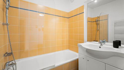 a bathroom with a sink and a shower and a tub at Virginia N 410 2P4 in Grasse