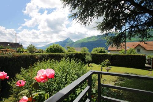 a view of a garden with flowers and a fence at Charming house with great views in Brison-Saint-Innocent
